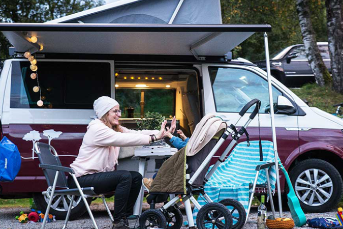 Baby sleeping comfortably in a VAN-IT campervan during a family road trip